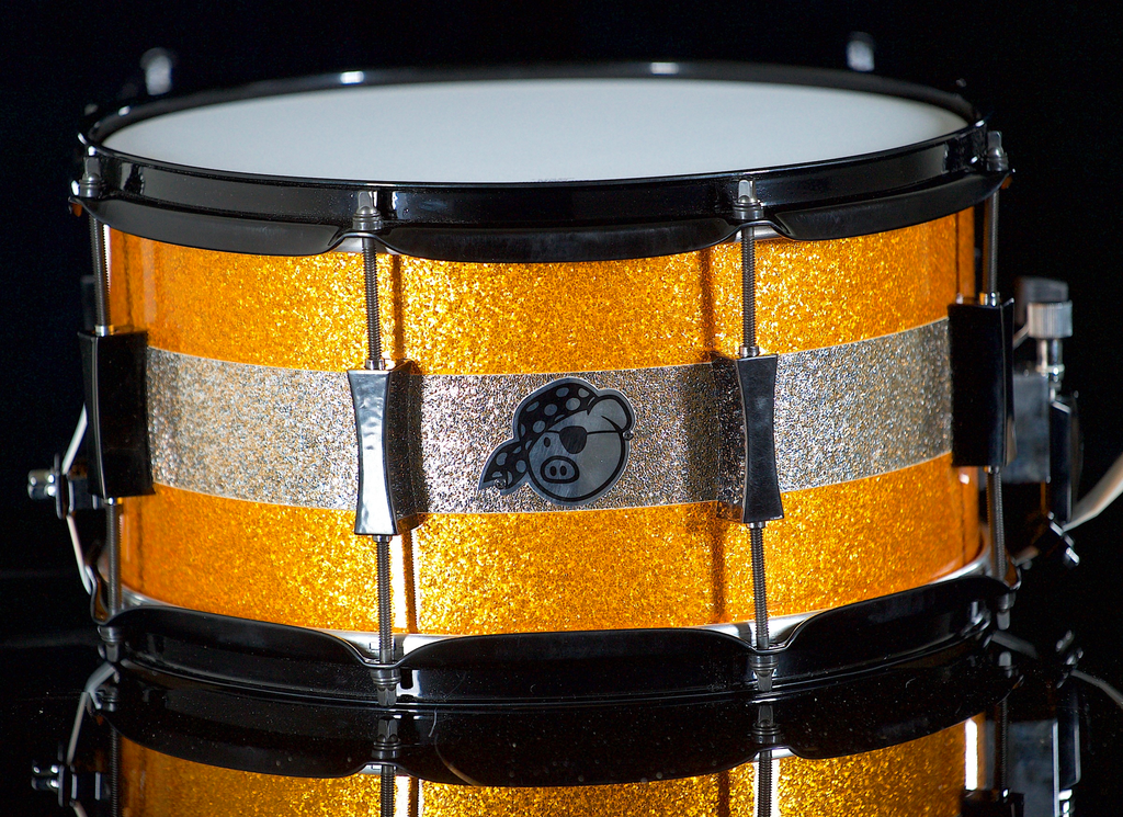 [PP7X13JPSN-OC] PORK PIE PERCUSSION 7" X 13" SNARE DRUM IN ORANGE SPARKLE AND CHAMPAGNE SPARKLE STRIPE W/ BLACK HARDWARE