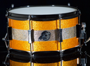 PORK PIE PERCUSSION 7" X 13" SNARE DRUM IN ORANGE SPARKLE AND CHAMPAGNE SPARKLE STRIPE W/ BLACK HARDWARE